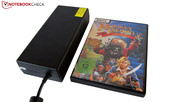 The 220-Watt AC adapter is as long as a DVD case. The 220-Watt AC adapter is as long as a DVD case.