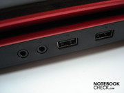 Two audio sockets (headphone & microphone) and two USB 2.0 ports are on the right