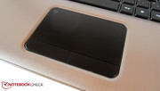 The touchpad surface is lightly rubberized.