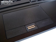 A fingerprint scanner sits between the touchpad keys.