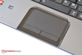 The surface of the touchpad is textured.