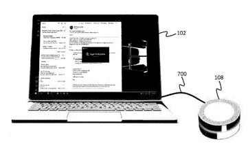 The dock can be wired to the PC to take voice input and VoIP calls. (Source: USPTO)