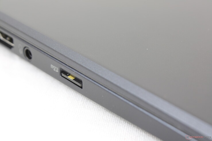 Spring-loaded SD card reader. The card sits completely flush against the edge and so it can be difficult to eject