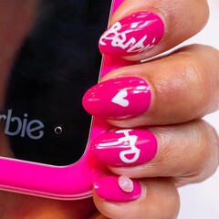 The HMD Barbie flip phone features the Barbie branding in large font and the classic 'Barbie-pink' device border. (Image source: HMD via X/Twitter)
