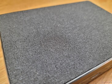 Top surface is a soft-touch mesh similar to what you see on many bookshelf speakers