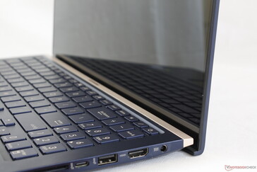 The "chin" bezel appears narrower than most other laptops because Asus hides most of it behind the base