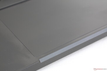 Clickpad is slightly rubberized when compared to the metal texture of the palm rests