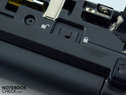 The battery lock is found underneath this.