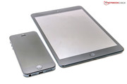 The iPhone 5 with a 4-inch screen beside the black iPad Mini.