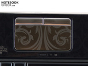 The buttons and the similarly smooth touchpad affect reflections.
