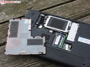 Pushing the battery slider to the left releases the base plate (no screws).