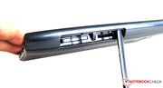 The SIM card slot and card reader become visible under the cover