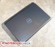 Lid and palm rest surfaces are both smooth and glossy