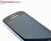 There are proximity and light sensors between the speakers and front camera.
