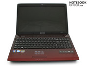 The work surface is covered in a red finish and the touchpad is integrated into there