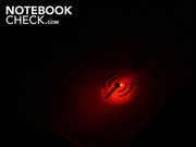 It lights up when active: red (WLAN) or blue (Bluetooth).