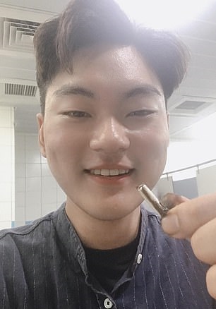 Ben Hsu happily reunited with his AirPod but in need of hand sanitizer. (Image source: Daily Mail/AsiaWire/Ben Hsu)