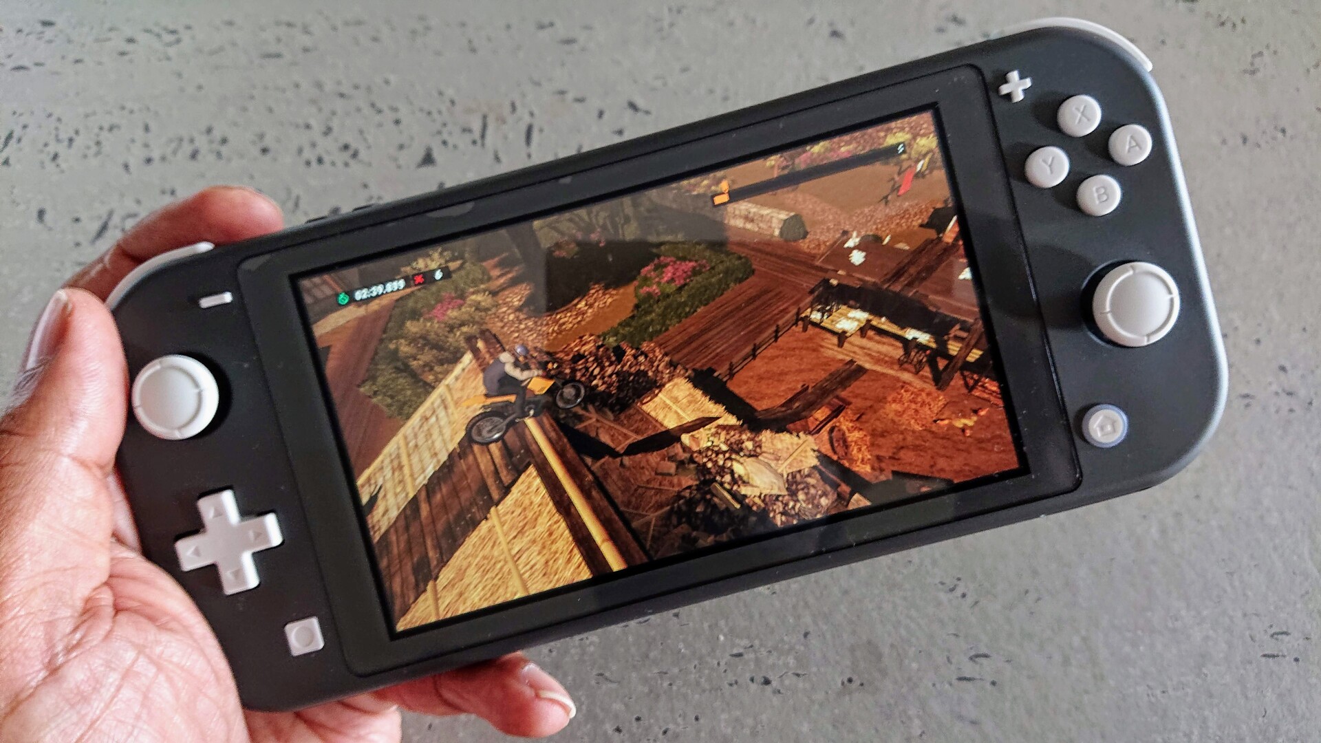 nintendo switch lite in hand