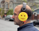 An image of a man wearing scrub daddy headphones.