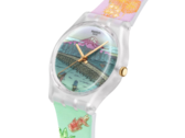 Colourful Swatch watch featuring a futuristic Tokyo cityscape, yellow lightning-shaped hands and a turquoise and blue design.