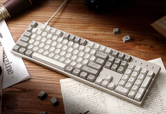 Keychron C2 Pro 8K on a desk surrounded by papers and books