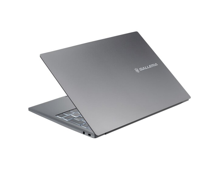 The laptop features a silver colorway and a minimal design.