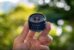 The cookie lens is overall smaller than a typical pancake lens, but not quite as flat (Image source: Laowa)
