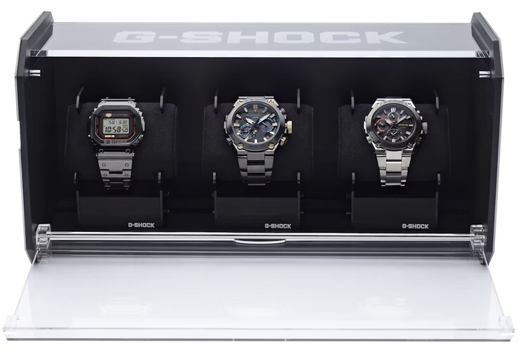 The steel G-Shock display case holds three watches, with a translucent top for solar charging. (Image source: Casio)