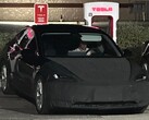 A masked Tesla Model 3 Highland was spotted charging with a unique, angular wheel design. (Image source: Reddit)