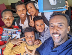 Mohammed (right) in his internet café, 