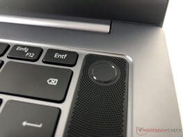 The power button and fingerprint sensor are located to the right of the keyboard