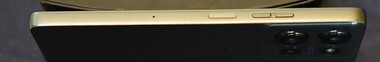 Right: Microphone, standby button, volume rocker