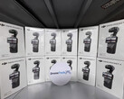 A stack of apparent DJI Osmo Pocket 4 Creator Combo retail units.