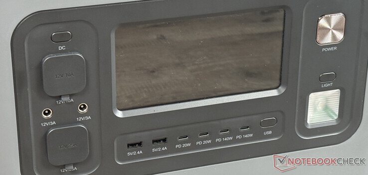 On the front: display, 6 USB and other DC ports, power button and LED light