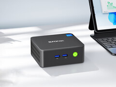 The G3 Pro starts at around $150 in China. Pictured: a promo image showing the mini PC beside a laptop. (Image source: GMKtec - edited)