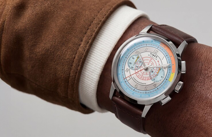 Timex Marlin Neo Classic Chronograph with a colorful silver dial and brown leather strap worn on a wrist.