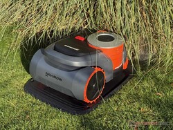 Navimow H2 on its charging station