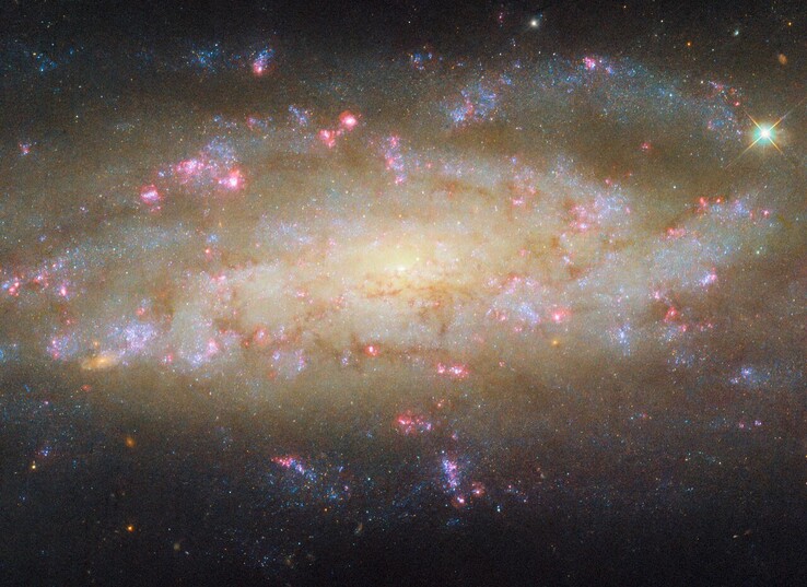 An image of the spiral galaxy NGC 7456 as captured by Hubble (Image source: ESA/Hubble, NASA, and D. Thilker)