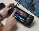 Asus ROG Ally X running Bazzite, with game titles visible on-screen and USB devices connected. (Image source: Dawid Does Tech Stuff)
