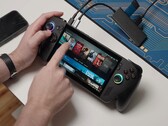 Asus ROG Ally X running Bazzite, with game titles visible on-screen and USB devices connected. (Image source: Dawid Does Tech Stuff)