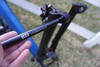 Thru-axle for added stability, rigidity, and straightness of the front tire