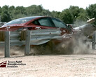 The Model 3 tears through guardrail in a crash test (Image credit: TTI)