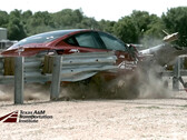 The Model 3 tears through guardrail in a crash test (Image credit: TTI)