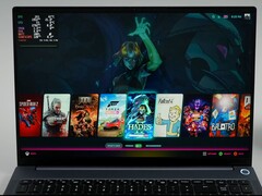 AIM MAX+ laptop running Bazzite with games like Spider-Man 2, The Witcher 3, and Hades shown in the launcher. (Image Source: ETA Prime on YouTube)