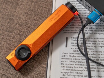The Olight ArkPro Ultra comes with a magnetic charging adapter for wireless charging.