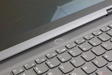 Fingerprint-enabled power button. The adjacent grilles are for cooling and not audio