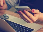 A phone user reading the screen (Image source: Firmbee/Unsplash)