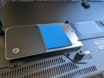 Dedicated heat spreader for the two SSDs. SSD performance would still throttle in our tests, however