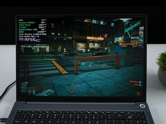 AIM Max+ laptop running Cyberpunk 2077 on integrated Radeon 8060S GPU, showing in-game overlay with TDP and CPU temperature. (Image source: ETA Prime on YouTube)