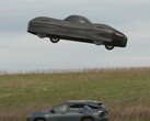 A screen grab shows Alef Aeronautics' electric Model A hovering above another car (Image source: NBC News on YouTube)